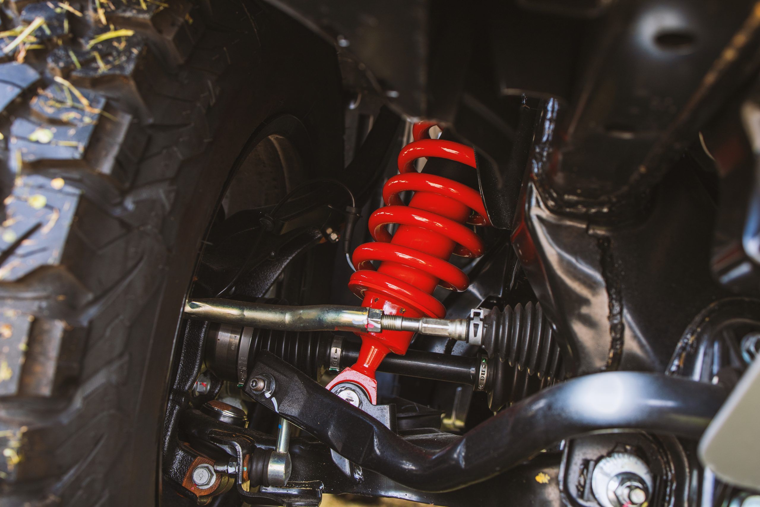 closeup wheels and shock absorbers with repair the suspension on the car. soft-focus and over light 01